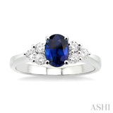 7x5mm Oval Cut Sapphire and 1/3 ctw Round Cut Diamond Ring in 14K White Gold