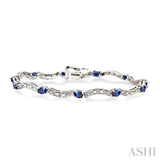 4x3 MM Oval Cut Sapphire and 1/10 ctw Single Cut Diamond Bracelet in 14K White Gold