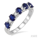 1/6 ctw Oval Shape 4X3MM Sapphire and Round Cut Diamond Precious Band in 14K White Gold